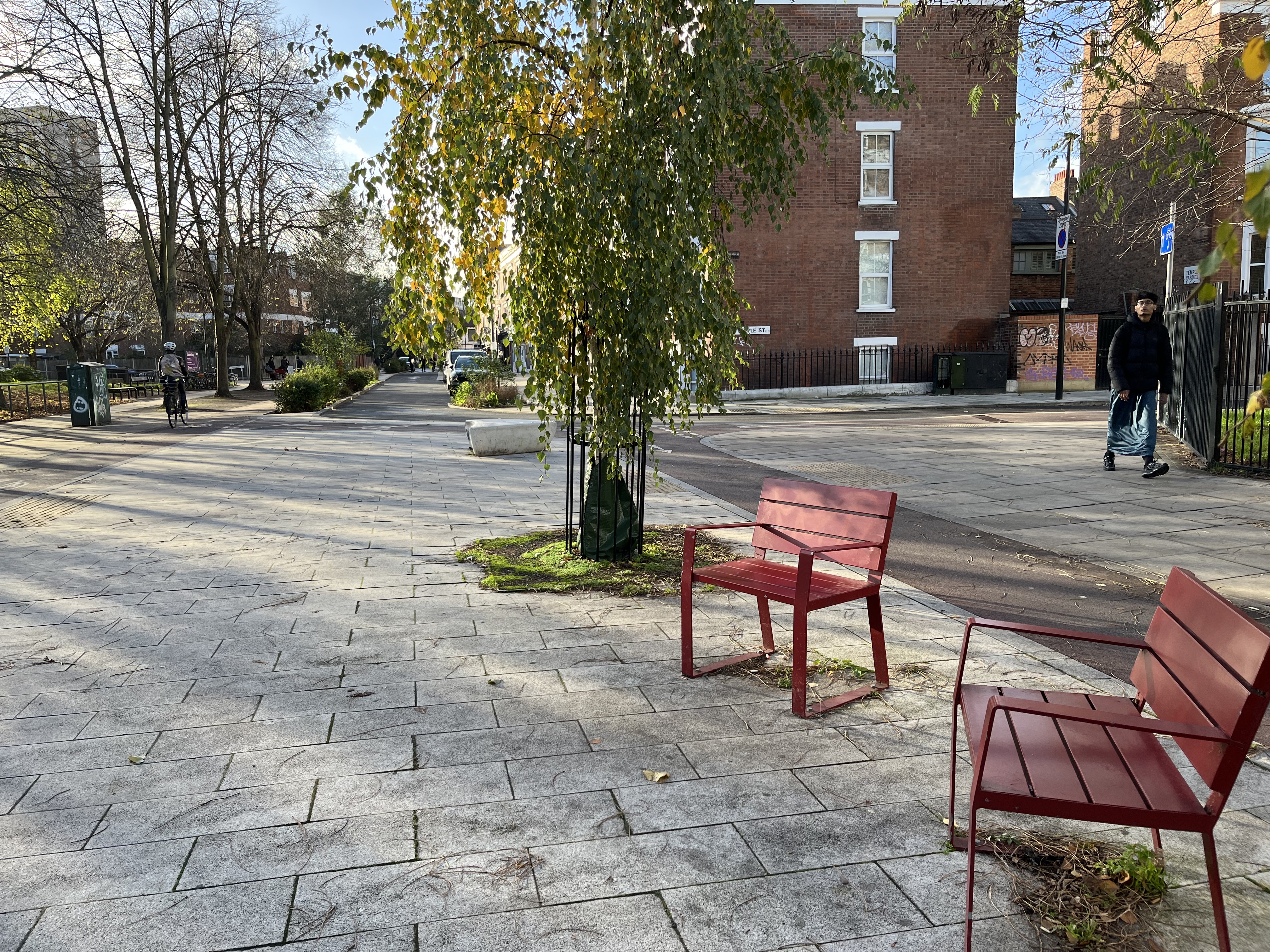 Red chairs on Old Bethnal Green Road LTN where Faruza likes to sit and chat to people.